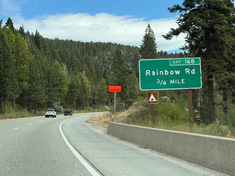 Interstate 80 sign reading Exit 168 Rainbow Road, three quarters of a mile